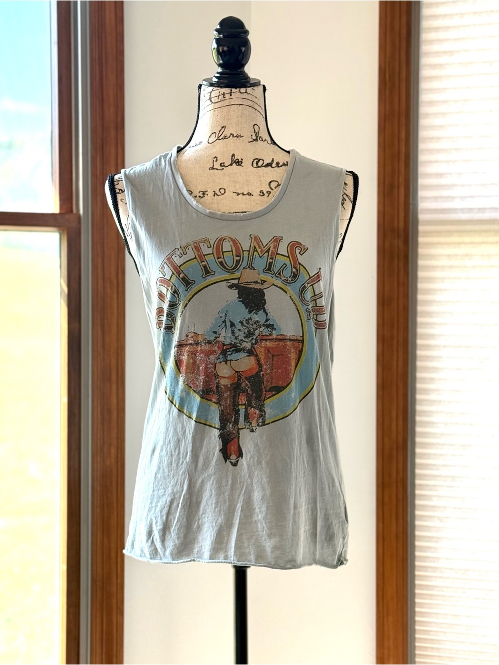 Vintage Style Light Blue Graphic Muscle Tee with a Western Saloon Print